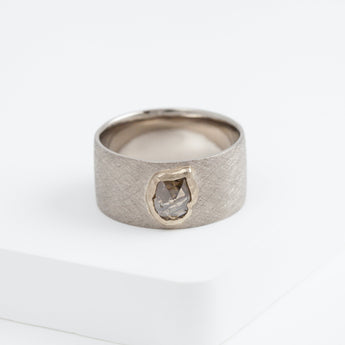 Flat white gold ring with unique brown diamond