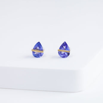 Band pear tanzanite studs