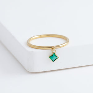 Swinging square emerald ring