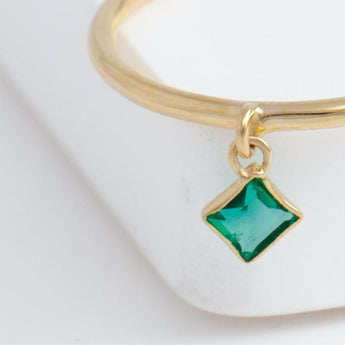 Swinging square emerald ring