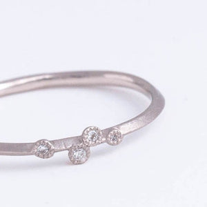 Spread four diamond platinum ring