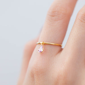 Swinging pear pink sapphire ring