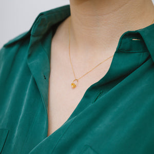 Rough stone gold grossular garnet pendant